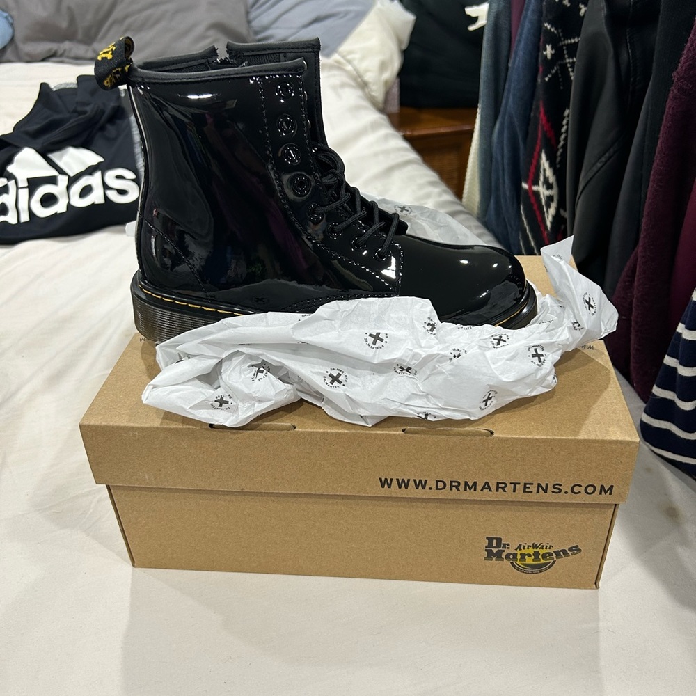 Brand new in the box unisex Dr Marten’s black size 4!
